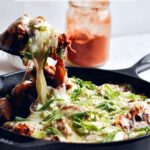 korean cheese buldak or fire chicken in cast iron skillet
