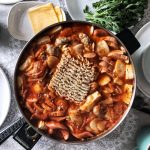 electric hot pot filled with budae jjigae and instant noodles