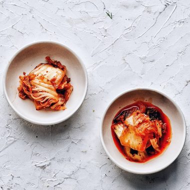 kimchi in two bowls with white background