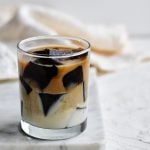 cup of coffee jello and sweet milk on white cutting board