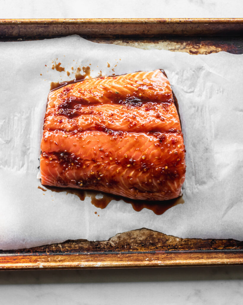 asian glazed spicy salmon on sheet pan