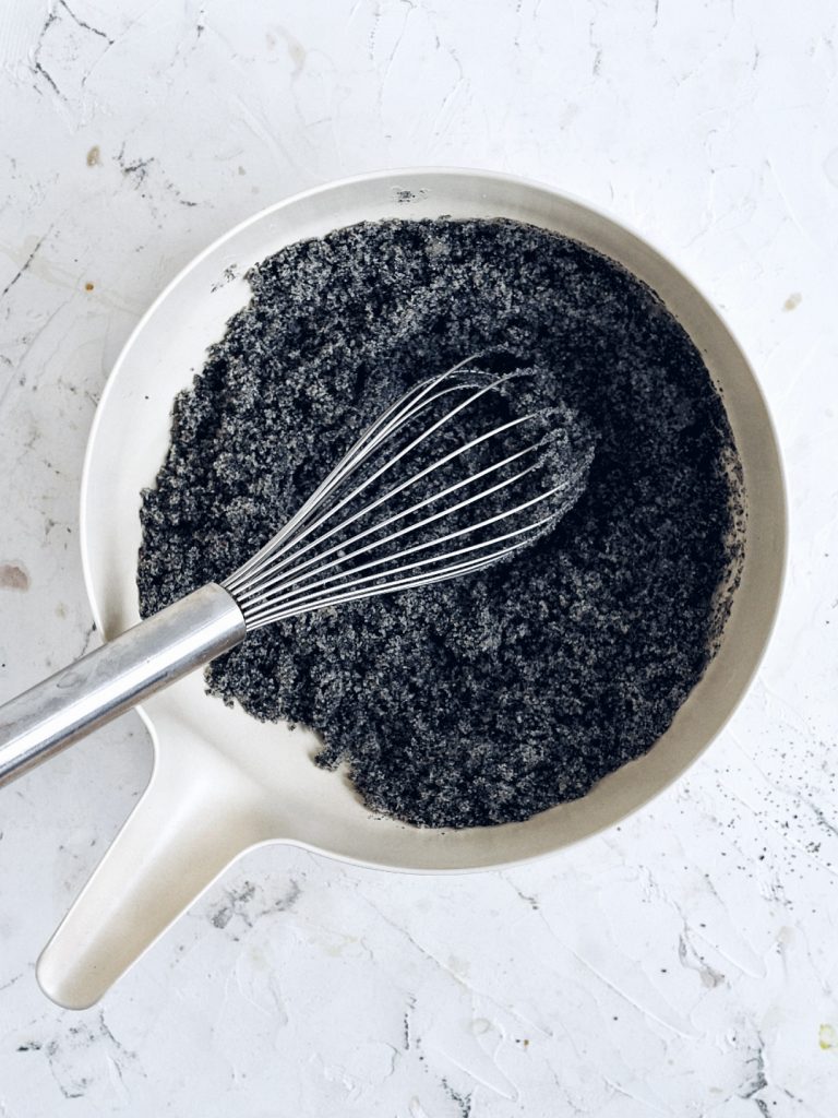 bowls with sugar, black sesame powder, and coconut milk