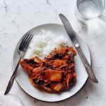 korean pork chops with kimchi pan sauce on plate, served with rice
