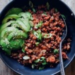 korean gochujang pork mince over rice in bowl with spoon