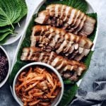oval platter of Bossam with radish kimchi