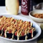 gimbap on platter, photographed on the side with drizzles of mayo