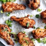 air fryer crispy chicken wings on parchment paper