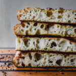 stack of no knead focaccia on cutting board