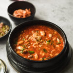 clay pot filled with seafood soondubu jjigae