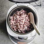 rice cooker filled with Korean purple rice