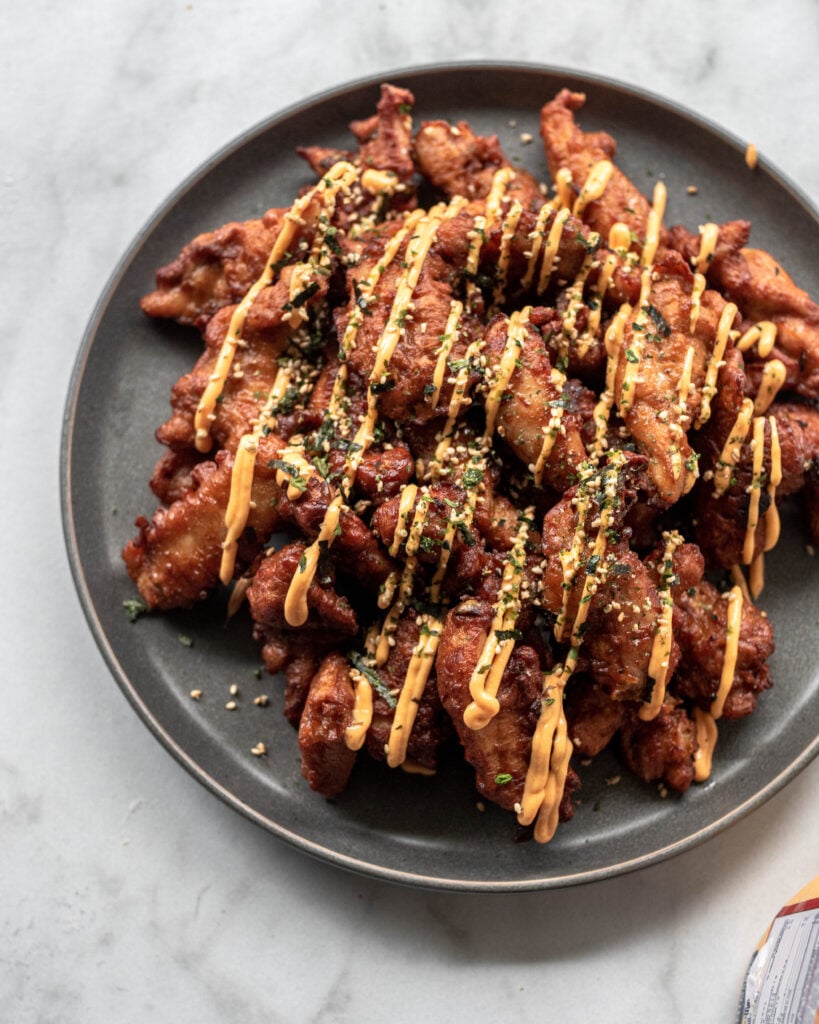 mochiko chicken with spicy mayo drizzles and furikake sprinkled on tops