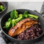 miso glazed salmon in bowl with rice and steamed broccoli