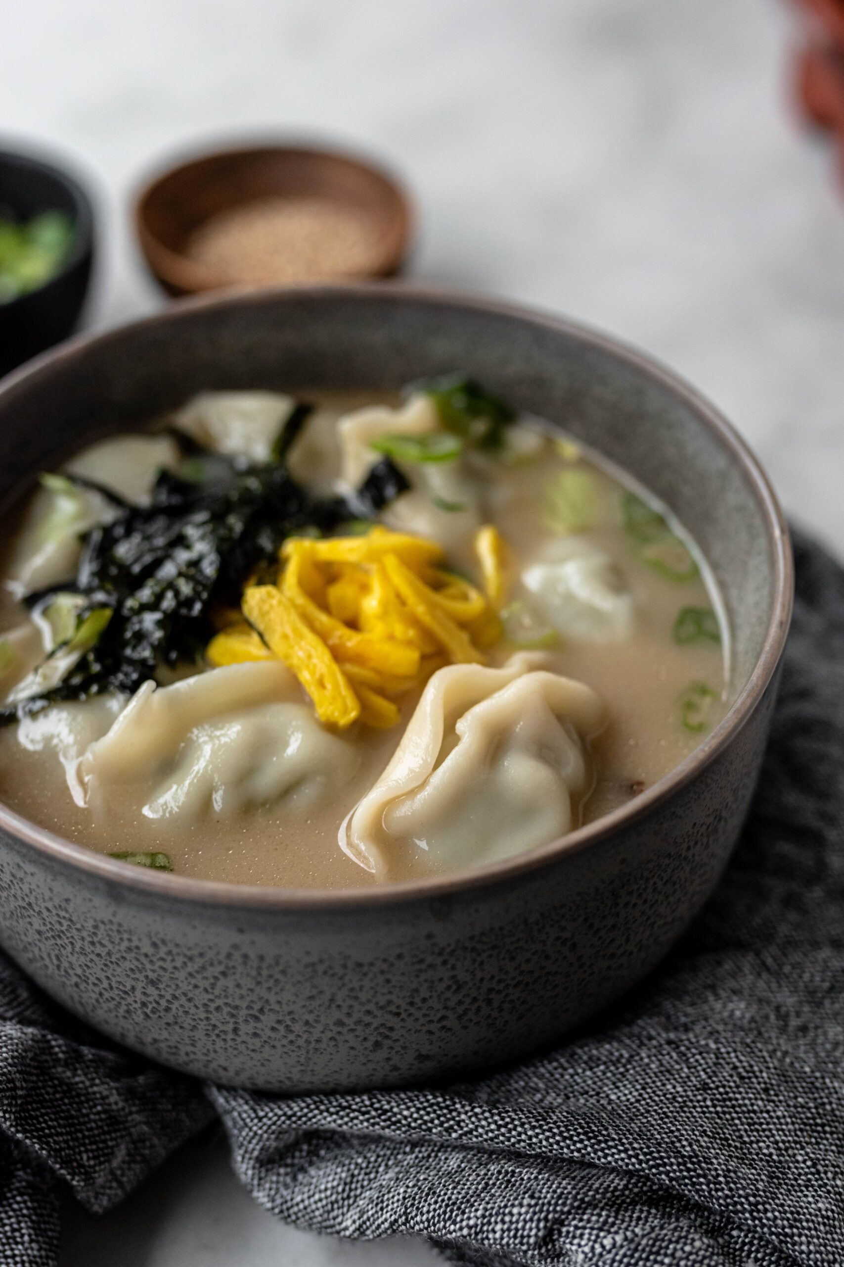 Tteok Mandu Guk (Korean Rice Cake Soup with bibigo Dumplings) The