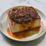 soft silken tofu on plate with korean dressing
