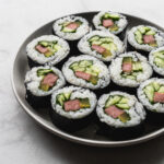 platter filled with Spam Gimbap or Korean Seaweed Rice Rolls