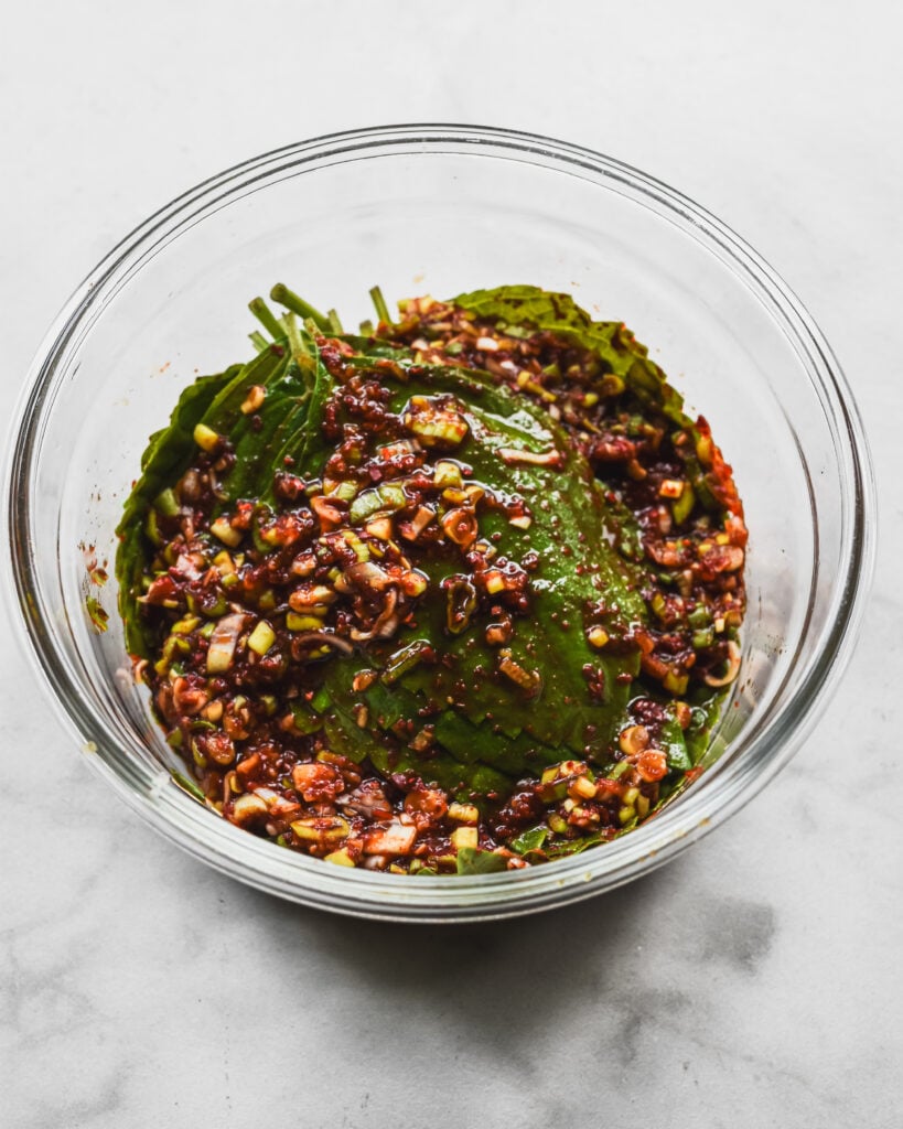 marinated korean perilla leaves (kkaennip) in glass bowl