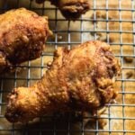 close up of market-style korean fried chicken drumsticks
