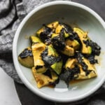 Japanese avocado salad with wasabi and nori in bowl with napkin