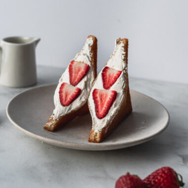 two halves of deep fried japanese cream sando on plate