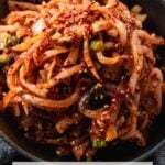 a small bowl filled with spicy korean radish salad or mu sangchae