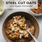 bowl filled with instant pot steel cut oats with apple cinnamon with spoon