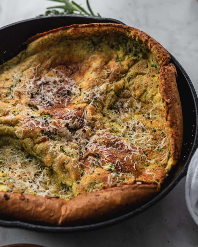 savory dutch baby with fresh herbs and parmesan cheese