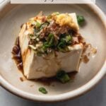 japanese cold tofu with green onion, bonito flakes, ginger, and drizzle of soy sauce