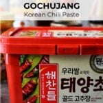red tub of gochujang with text overlay: a beginner's guide: gochujang korean chili paste