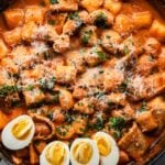rose tteokbokki with hard boiled eggs and fish cakes