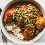 dak dori tang (korean spicy braised chicken) in bowl over rice with text overlay: 7 easy recipes with Gochujang Korean Chili Paste