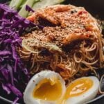 bibim guksu or korean cold spicy noodles with text overlay: weeknight dinner ideas, 10 easy korean recipes