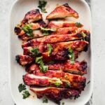 gochujang chicken sliced on a plate with text overlay: weeknight dinner ideas, 7 easy recipes with gochujang