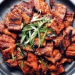 spicy pork belly bulgogi with text overlay: weeknight dinner ideas, 7 easy recipes with gochujang
