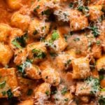 rose tteokbokki (korean rice cakes) with parmesan cheese and text overlay: weeknight dinner ideas 10 easy korean recipes