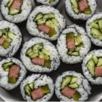 spam gimbap on a plate with text overlay: weeknight dinner ideas, 10 easy korean recipes