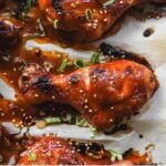 gochujang chicken drumsticks on a sheet pan with text overlay: weeknight dinner ideas, 7 easy recipes with gochujang
