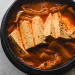 kimchi jjigae with tofu in korean earthenware pot