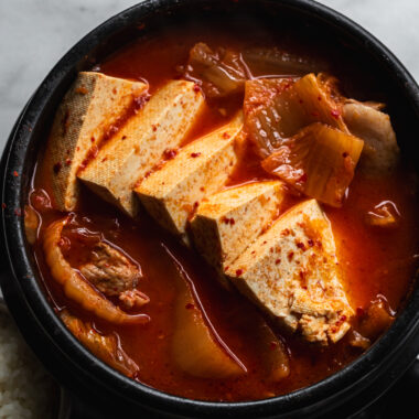 korean kimchi stew with tofu slices in korean clay pot