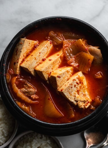 korean kimchi stew with tofu slices in korean clay pot