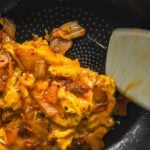 kimchi scrambled eggs in pan