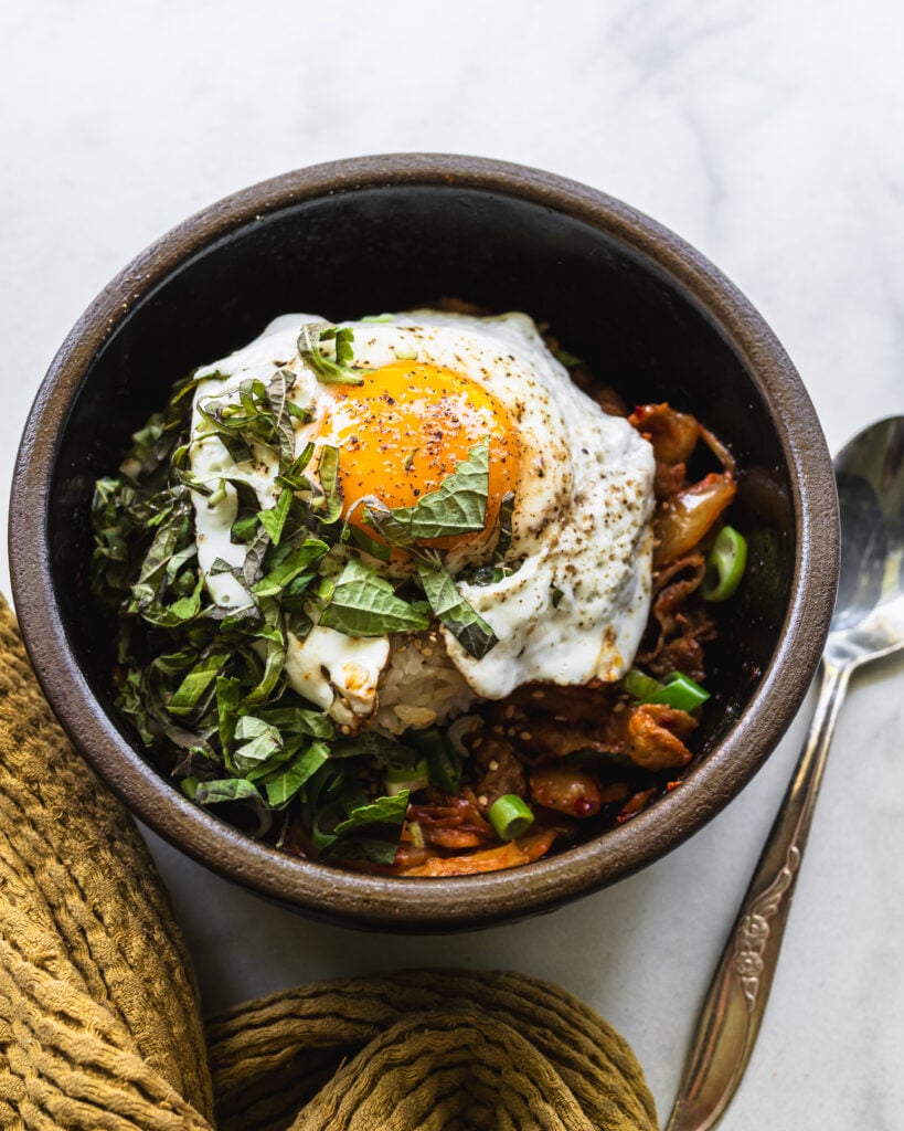 kimchi pork rice bowl in korean clay pot