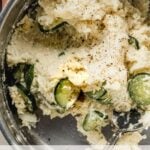 korean potato salad in saucepan with spoon