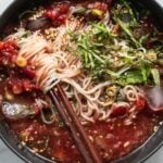 cold tomato somyeon noodles with chopsticks