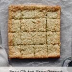 coconut mochi cake cut into squares on parchment paper