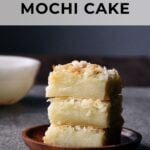 coconut mochi cake squares stacked on top of each other