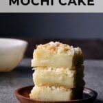 coconut mochi cake squares stacked on top of each other