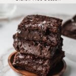 squares of chocolate mochi brownies stacked on top of each other