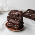 squares of chocolate mochi brownies stacked on top of each other