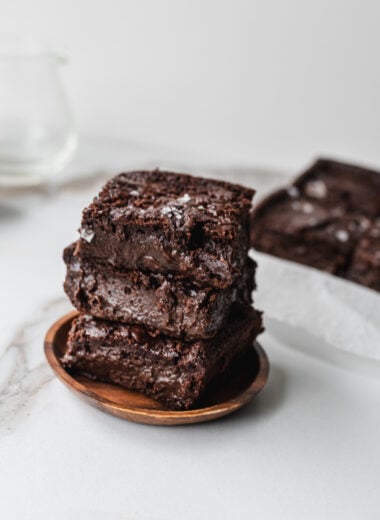 squares of chocolate mochi brownies stacked on top of each other